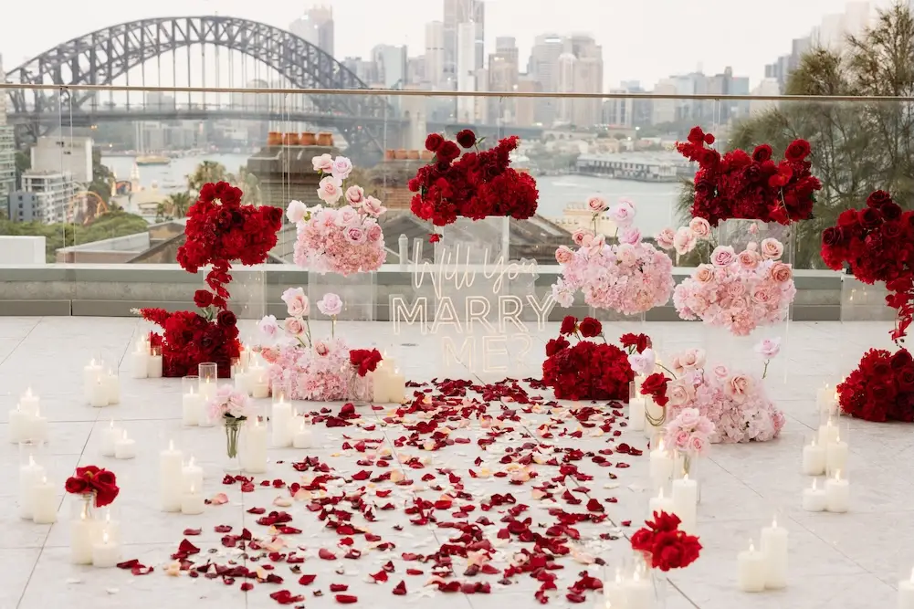 rooftop view with red and pink floral arrangement