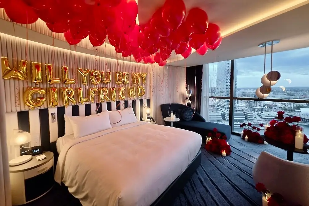 Will you be my girlfriend? balloons in hotel room